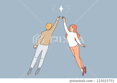 Mystical attraction of man and woman in love, reaching for same star, striving to be together 125025753