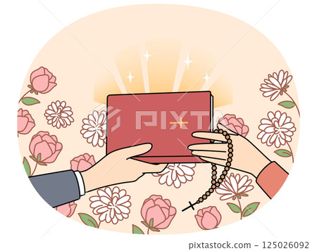 Hands of people with christian bible near flowers, during exchange of religious literature Hands of people with christian bible near flowers, during exchange of religious literature 125026092