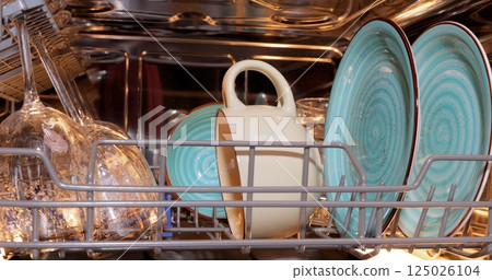 Open dishwasher with clean dishes. Housekeeping concept. 125026104