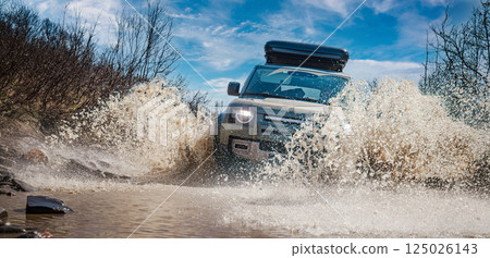 Off road tourist car rides off-road in the highlands. Off road tourist car rides off-road in the highlands. 125026143