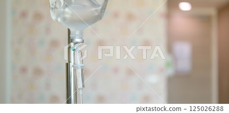 Close up medical intravenous IV drip in hospital background 125026288