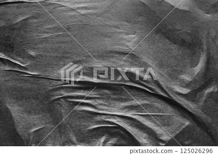 Black crumpled and creased paper poster grunge texture background 125026296
