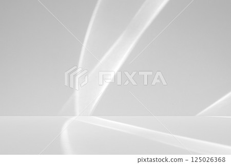 Abstract white studio room with light and shadow from window background for product display presentation Abstract white studio room with light and shadow from window background for product display presentation 125026368