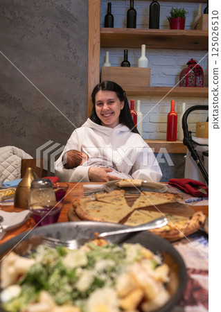 Cozy Family Dining with Breastfeeding Mother Cozy Family Dining with Breastfeeding Mother 125026510