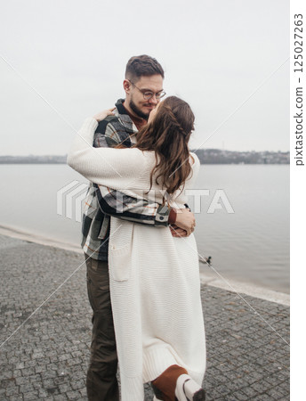 Romance outdoors dancing. Happy young couple dancing in stylish clothes. Romantic and spontaneous date moment 125027263