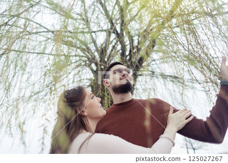 Romance outdoors dancing. Happy young couple dancing in stylish clothes. Romantic and spontaneous date moment Romance outdoors dancing. Happy young couple dancing in stylish clothes. Romantic and spontaneous date moment 125027267