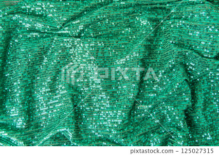 Green sequined fabric background 125027315