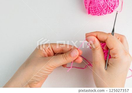 Crochet magic ring with pink yarn Crochet magic ring with pink yarn 125027357