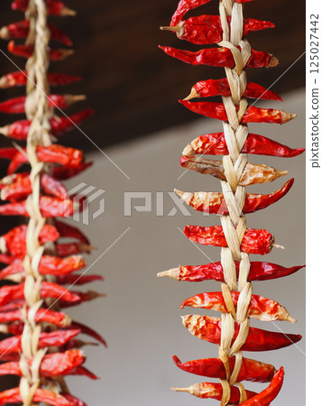Hanging red chili pepper decorations to ward off evil spirits 125027442