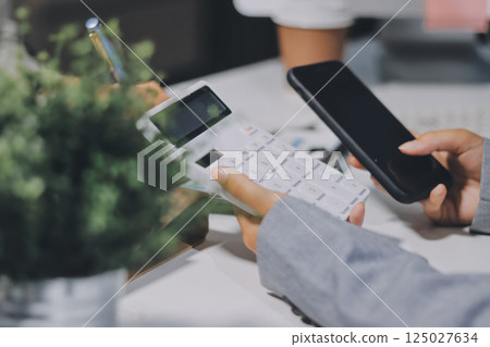 Portrait of Asian young female working on laptop at office 125027634