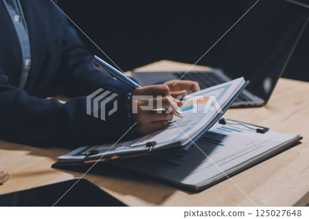 Portrait of Asian young female working on laptop at office 125027648
