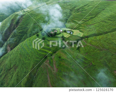 Aerial view of beautiful high altitude forest grassland mountain landscape Aerial view of beautiful high altitude forest grassland mountain landscape 125028170
