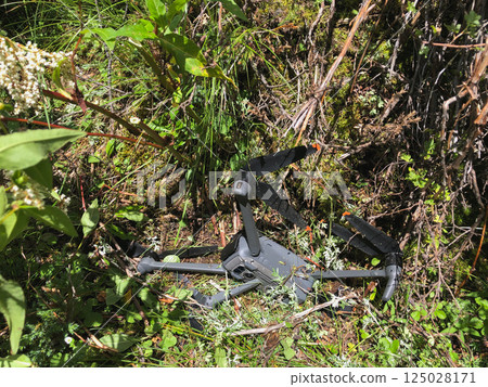 Drone crashed into the ground during flight over high altitude forest, attacked by eagle Drone crashed into the ground during flight over high altitude forest, attacked by eagle 125028171