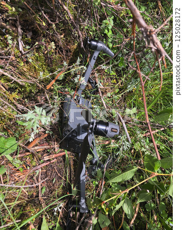 Drone crashed into the ground during flight over high altitude forest, attacked by eagle Drone crashed into the ground during flight over high altitude forest, attacked by eagle 125028172
