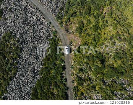 Driving off road car on high altitude mountains Driving off road car on high altitude mountains 125028216