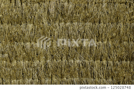 Dry grass hanging in tied bunches creating a textured background Dry grass hanging in tied bunches creating a textured background 125028748