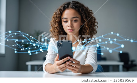 A young woman with curly hair interacts with her smartphone, surrounded by colorful digital connections in a modern environment A young woman with curly hair interacts with her smartphone, surrounded by colorful digital connections in a modern environment 125029569