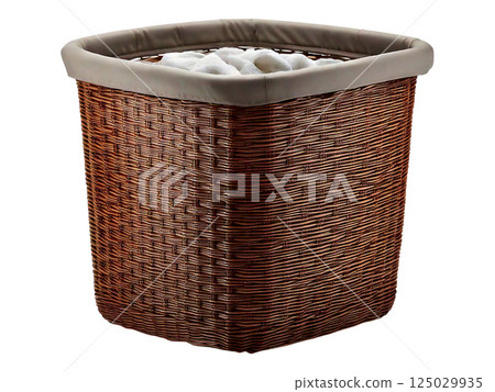 Stylish brown wicker laundry basket with a beige fabric liner, filled with soft white towels. Perfect for bathroom organization, home decor, and lifestyle imagery. 125029935