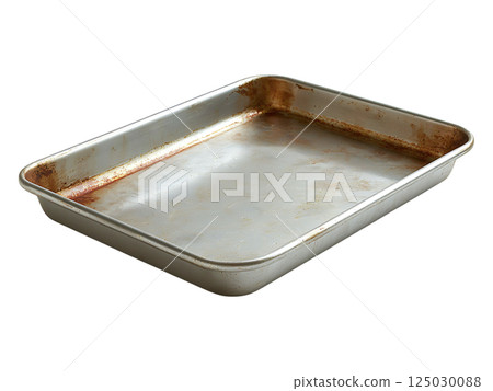 A wellused, rustic metal baking sheet shows signs of age and many uses. Its slightly stained and worn surface adds character, perfect for rustic, vintage, or nostalgic concepts. A wellused, rustic metal baking sheet shows signs of age and many uses. Its slightly stained and worn surface adds character, perfect for rustic, vintage, or nostalgic concepts. 125030088