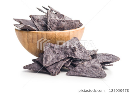 Dark nachos chips isolated on white background. 125030478