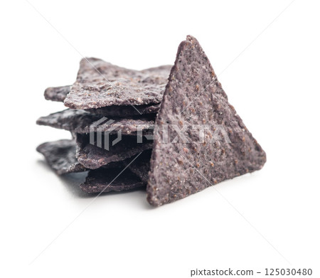 Dark nachos chips isolated on white background. 125030480