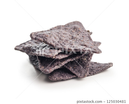Dark nachos chips isolated on white background. Dark nachos chips isolated on white background. 125030481