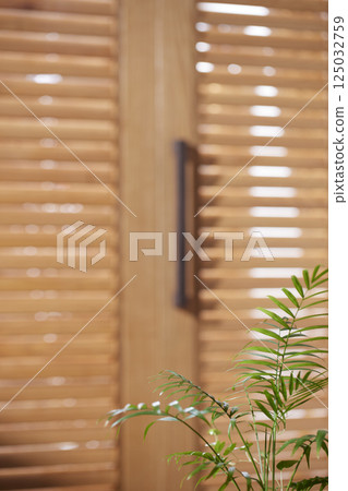 Sunlight and Shadows in a Cozy Wooden Interior. 125032759