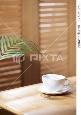 Sunlight and Shadows in a Cozy Wooden Interior. 125032769