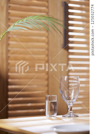 Sunlight and Shadows in a Cozy Wooden Interior. 125032774