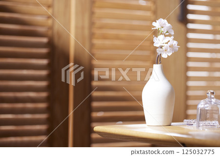 Sunlight and Shadows in a Cozy Wooden Interior. 125032775