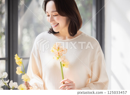 A woman with flowers 125033457