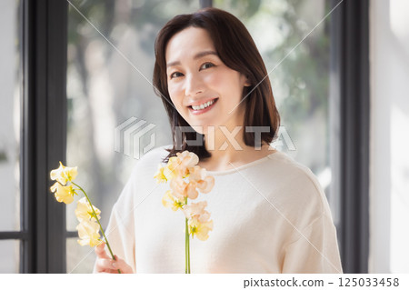 A woman with flowers A woman with flowers 125033458