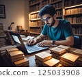 Man studying in the library 125033908