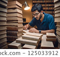 A man reading a book 125033912