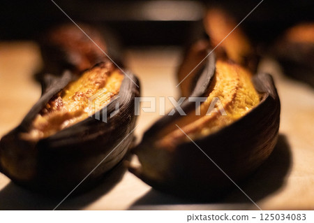 Baked plantains with white cheese Baked plantains with white cheese 125034083