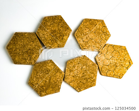 Six cork hot plate trivets in hexagon shape isolated on white background Six cork hot plate trivets in hexagon shape isolated on white background 125034500