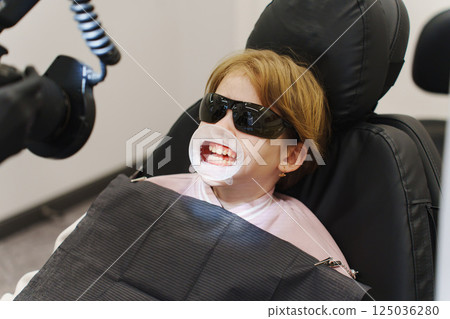 Professional dental hygiene for children in a dental clinic setup 125036280