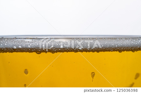 Close up of beer bubbles in a chilled glass. High quality photo 125036398