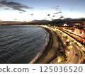 Landscape photo of seaside town at night and illuminated streetscape 125036520
