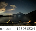 Night view of Mt. Fuji and camping on the lakeside in winter 125036524