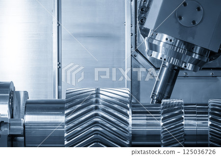 The multi tasking CNC lathe machine gear cutting on the metal shaft part with indexable tool in the light blue scene. 125036726