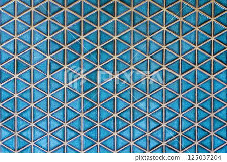Blue ceramic tile background. Old vintage ceramic tiles in blue to decorate the kitchen or bathroom  125037204