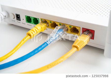 Ethernet cable with wireless router connect to internet service provider internet network. 125037998