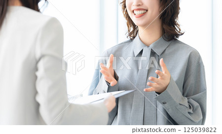 Two women/businesswomen having a meeting Two women/businesswomen having a meeting 125039822