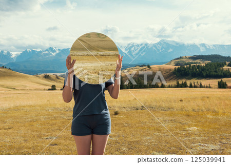 Woman in blue dress in summer Altai mountains 125039941