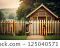 Wooden Cabin with Picket Fence Amidst Lush Greenery and Rolling Hills at Sunset 125040571