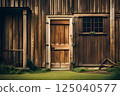Vintage Wooden Door on a Rustic Brown Cabin Surrounded by Greenery 125040577