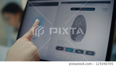 Airport Check-in Counter: Close Up of Woman Putting Finger on Touch Screen to Scan Fingerprint Airport Check-in Counter: Close Up of Woman Putting Finger on Touch Screen to Scan Fingerprint 125040705