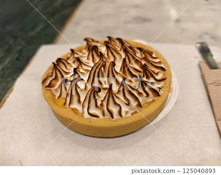 pumpkin pie on a cutting board pumpkin pie on a cutting board 125040893