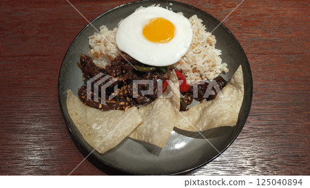 rice with pork or beef or other meat ingredients 125040894